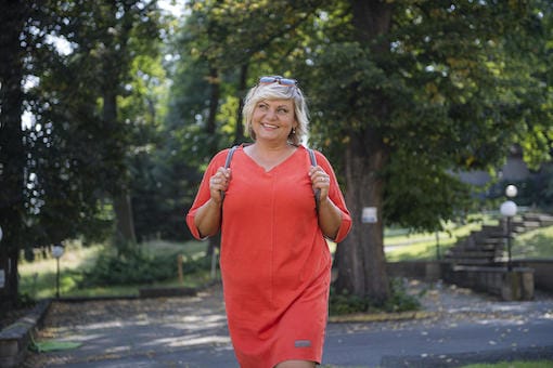 Lady purchasing fruit from a market stall